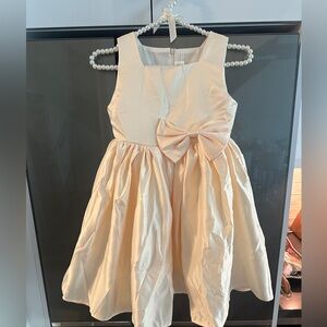 CHAMPAGNE LITTLE GIRLS SATIN DRESS WITH BOW DETAILING ON FRONT & BACK